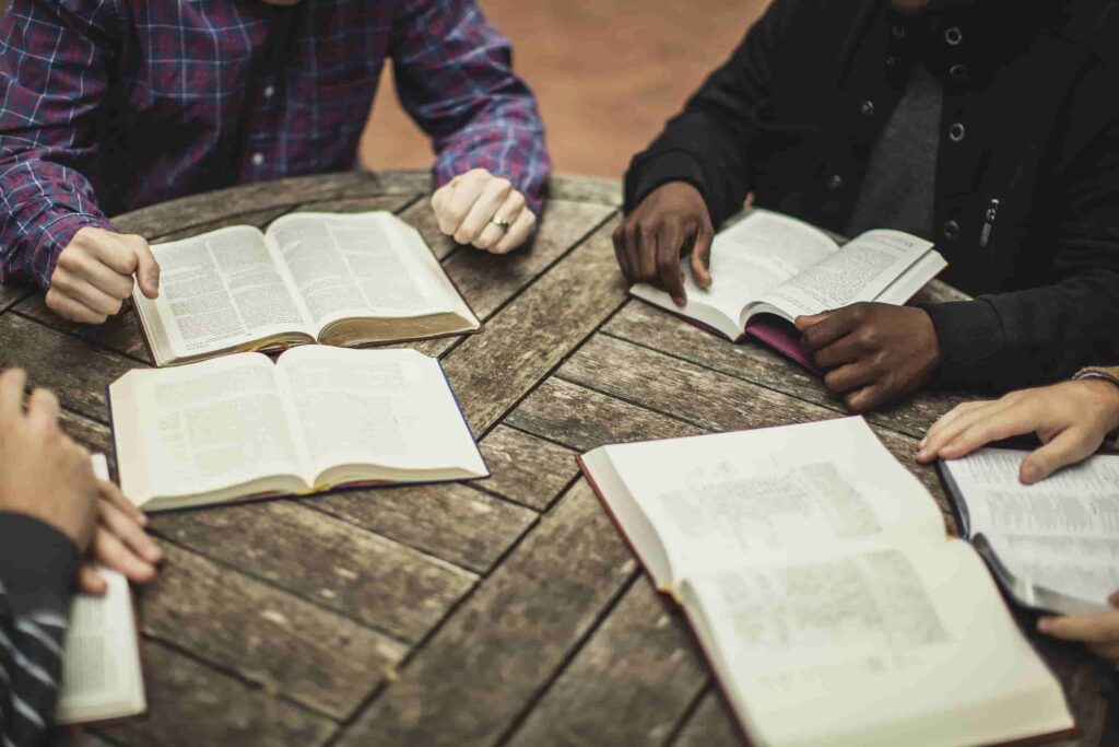 Men at a table meeting for a Bible study